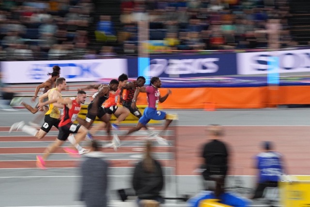 Sprinter leaning at finish line
